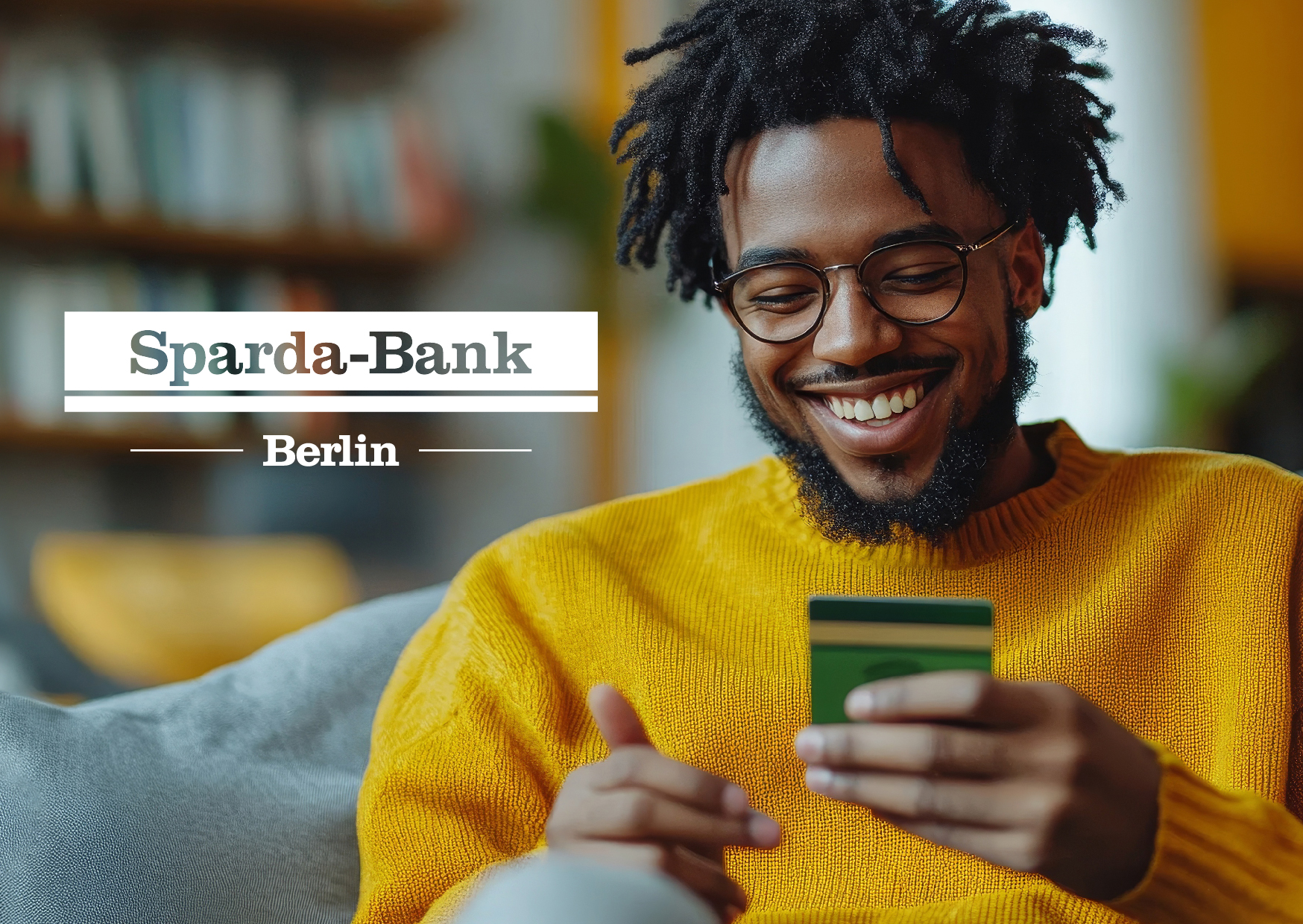 Cover of a success case with Sparda-Bank Berlin, featuring a cheerful young man with dreadlocks wearing a yellow sweater, looking at a smartphone.