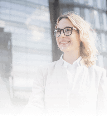 Smiling Statista expert standing outside a company building.