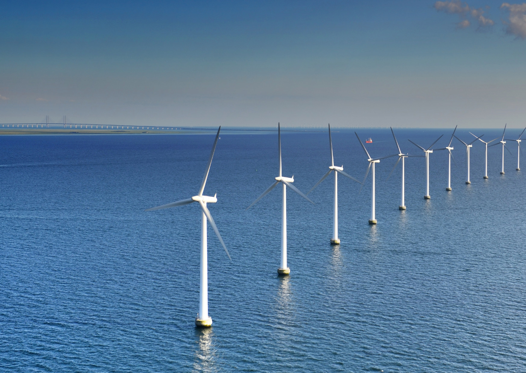 Wind turbines lined in the sea in northern Europe.